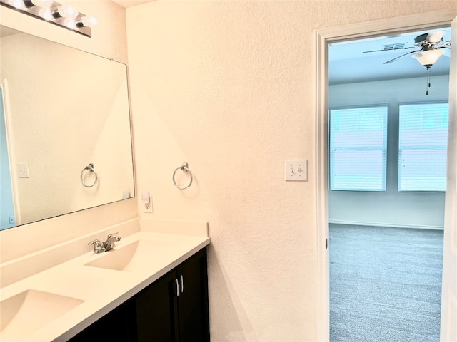 bathroom with dual bowl vanity and ceiling fan