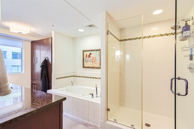 bathroom featuring a garden tub, a shower stall, visible vents, and recessed lighting