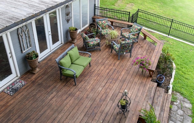 deck with an outdoor living space and french doors