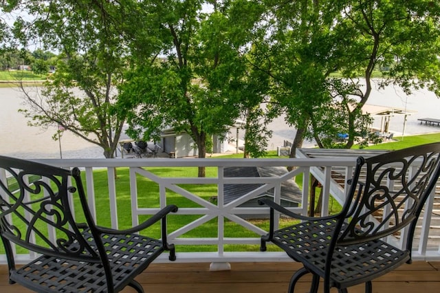 wooden terrace with a lawn