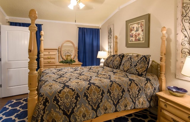 bedroom with hardwood / wood-style flooring, ceiling fan, and crown molding