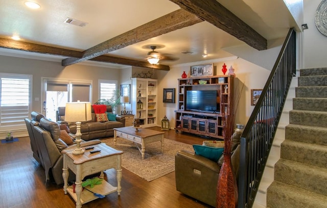 living room with beamed ceiling, ceiling fan, crown molding, and dark wood-type flooring