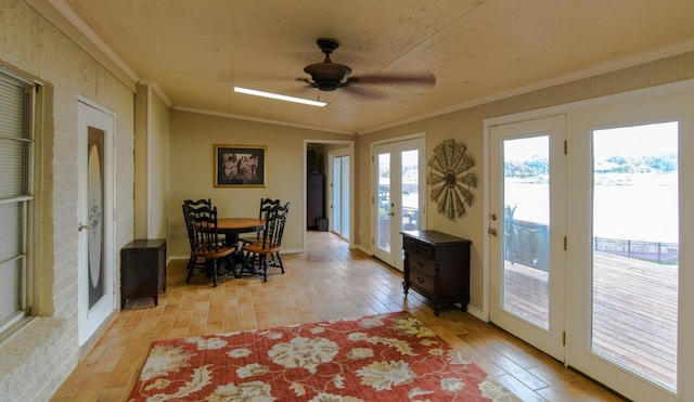 dining room featuring ceiling fan, light hardwood / wood-style floors, and a wealth of natural light