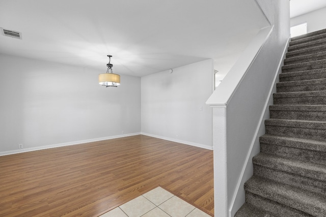 stairway featuring hardwood / wood-style floors