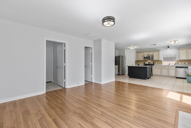 unfurnished living room with light wood-type flooring