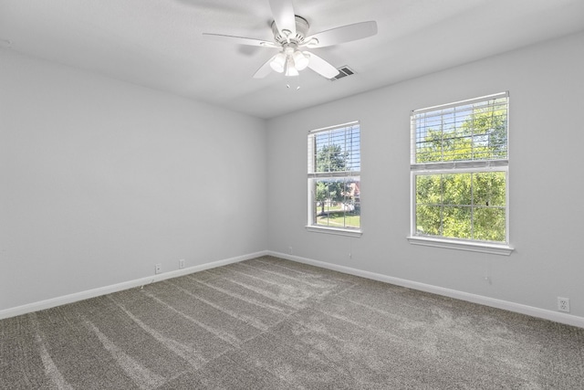 carpeted empty room with ceiling fan