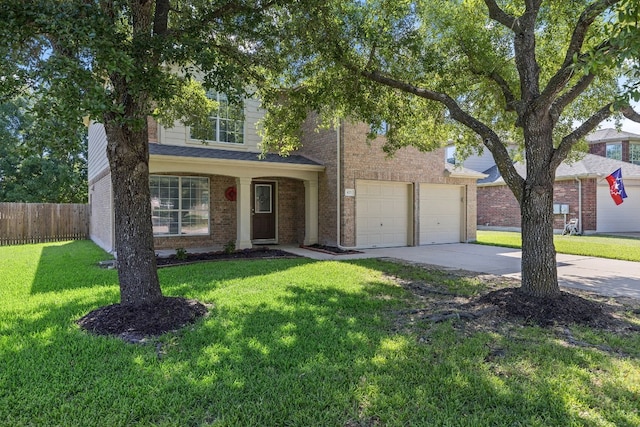 view of front of property featuring a front lawn and a garage