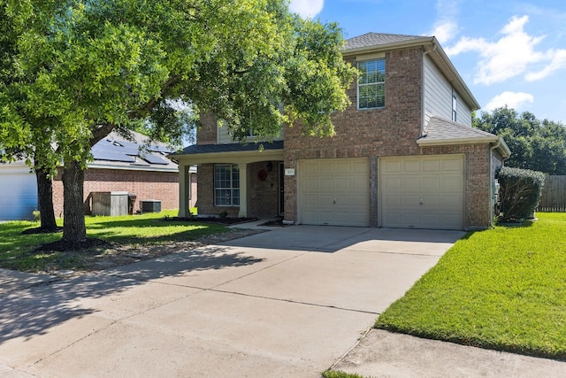 view of front of home with central AC, a front lawn, and a garage