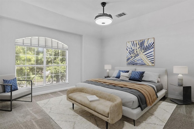 bedroom with light carpet