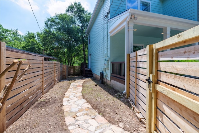 view of side of property featuring fence