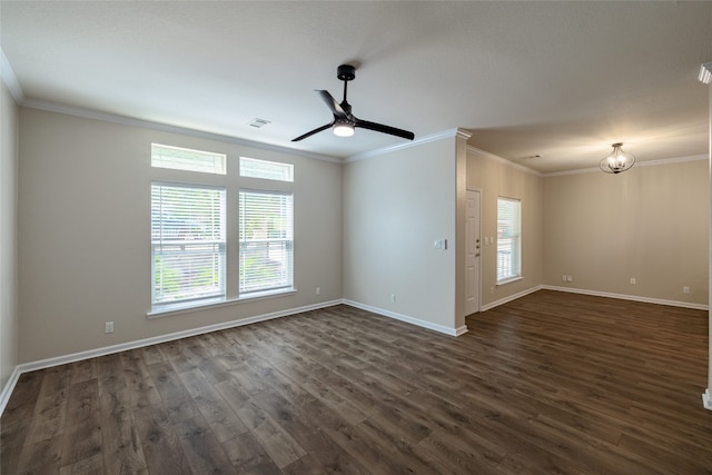 spare room featuring crown molding, dark wood-type flooring, and ceiling fan