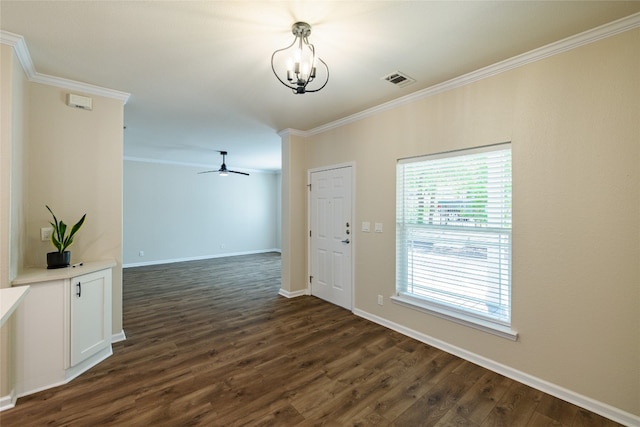 entryway featuring ceiling fan with notable chandelier, visible vents, baseboards, ornamental molding, and dark wood finished floors