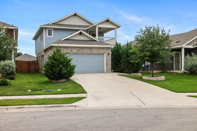 view of front facade featuring a balcony, a front lawn, and a garage