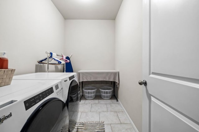 laundry room featuring washing machine and dryer