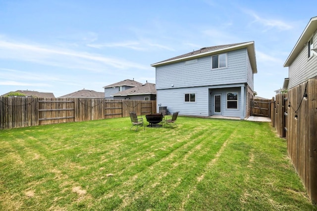 rear view of house with a yard