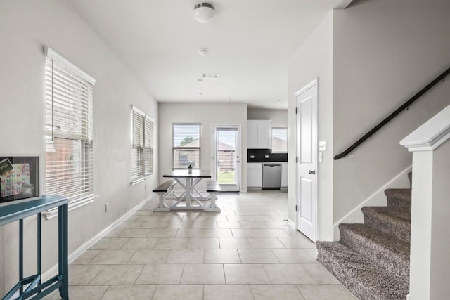 foyer entrance featuring light tile patterned floors