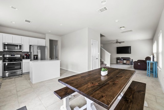 dining space with ceiling fan