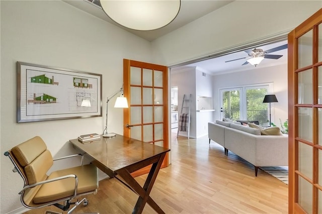 office area featuring french doors, light hardwood / wood-style floors, ceiling fan, and ornamental molding