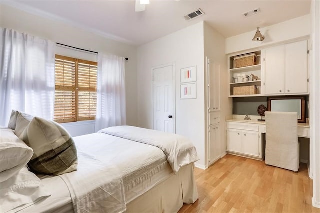 bedroom with ceiling fan and light hardwood / wood-style flooring