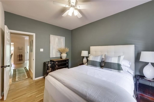 bedroom featuring ceiling fan and light wood-type flooring