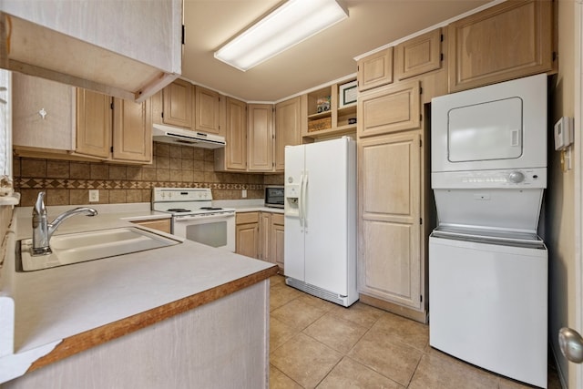 kitchen featuring stacked washer / dryer, white appliances, sink, light tile flooring, and light brown cabinetry