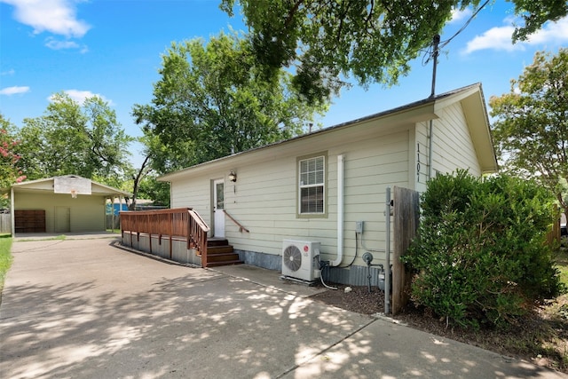 back of house with a garage and an outdoor structure