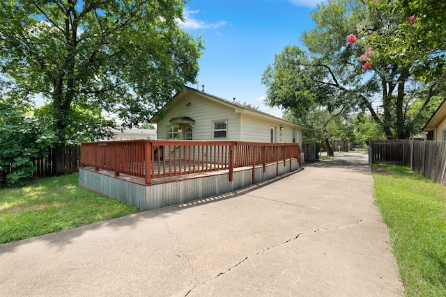 exterior space with a yard and a deck