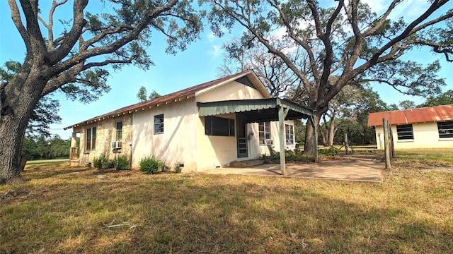 view of property exterior featuring a lawn