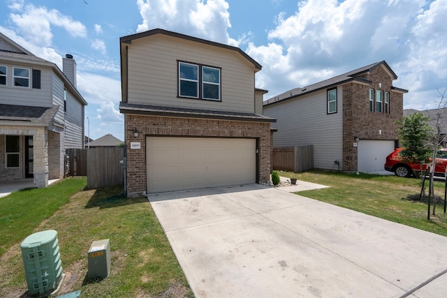 view of property featuring a front lawn and a garage