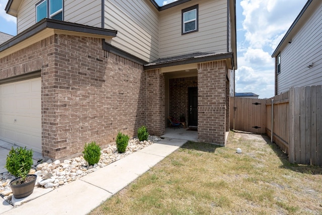 entrance to property featuring a garage