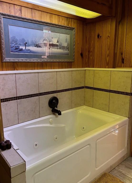 bathroom with a jetted tub