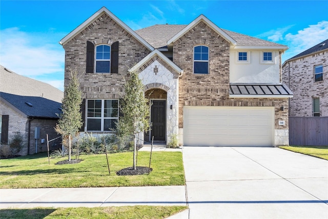 view of front of property featuring a front yard and a garage