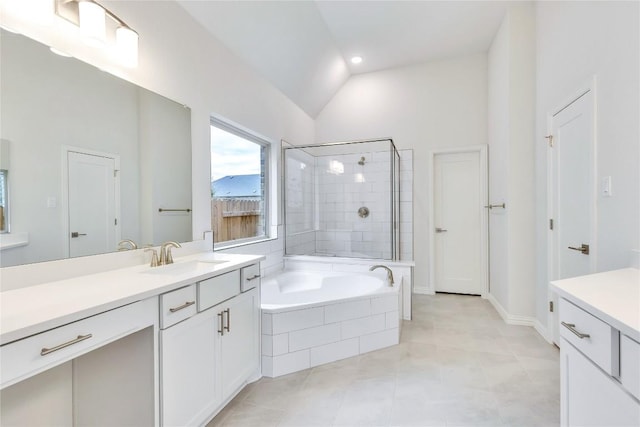 bathroom with tile patterned flooring, vanity, separate shower and tub, and lofted ceiling