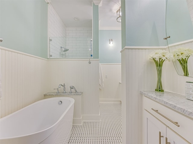 full bathroom featuring a freestanding bath, a walk in shower, and wainscoting
