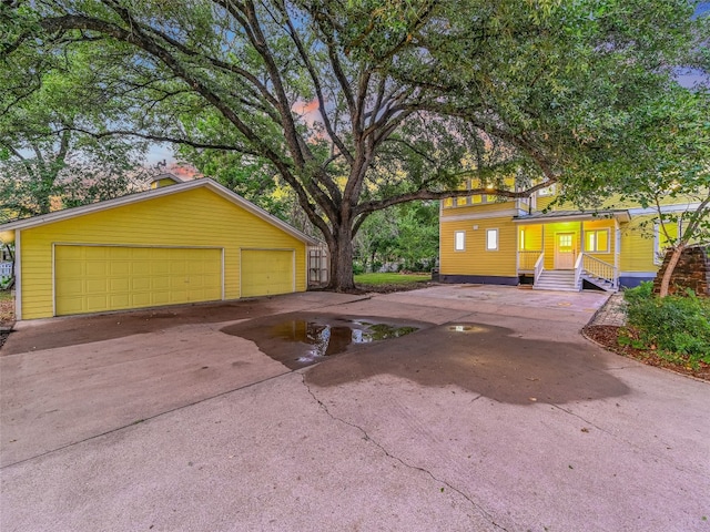 exterior space with a garage and an outdoor structure