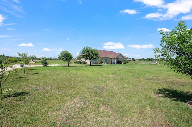 view of yard with a rural view