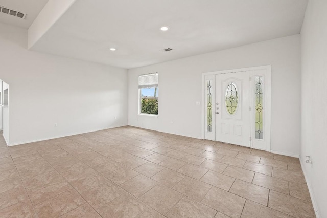 foyer featuring light tile patterned floors