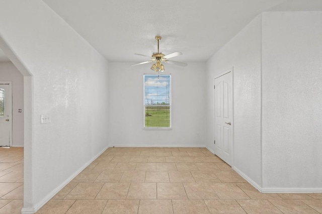 unfurnished room with ceiling fan