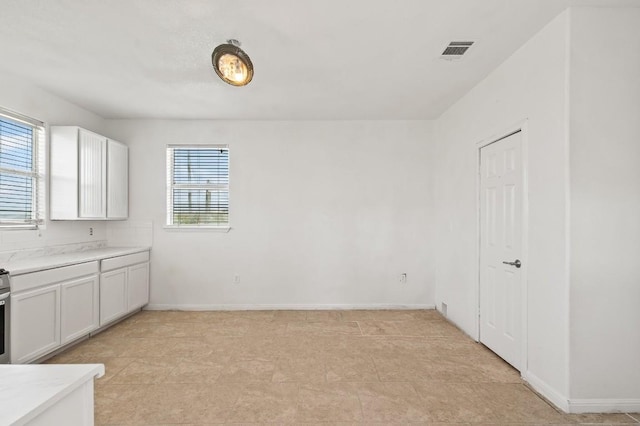 interior space featuring white cabinetry