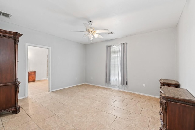 unfurnished room featuring ceiling fan and light tile patterned flooring