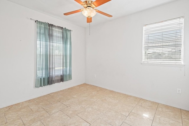 empty room with plenty of natural light and ceiling fan