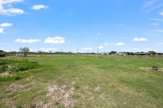 view of yard with a rural view