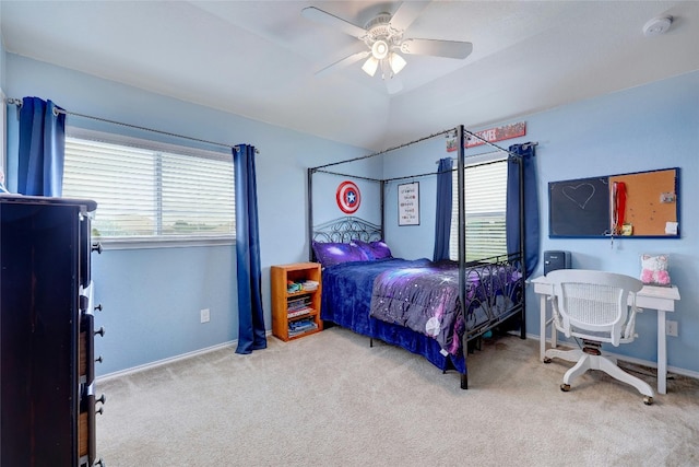 bedroom featuring ceiling fan, light colored carpet, and vaulted ceiling