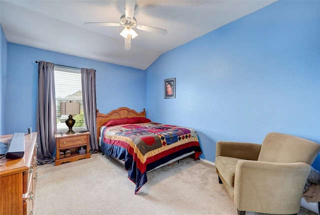 bedroom featuring ceiling fan, light colored carpet, and lofted ceiling