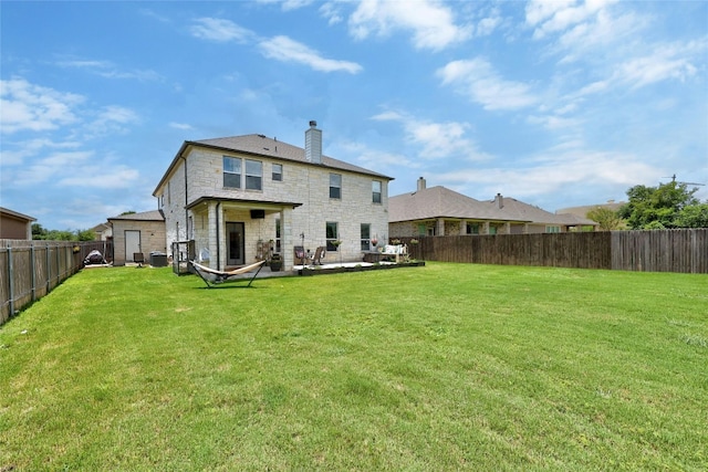 31451 Kingsway Rd, Georgetown, TX 78628 - back of house with a fenced backyard, stone siding, a patio area, and a chimney