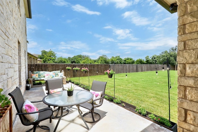 31451 Kingsway Rd, Georgetown, TX 78628 - fenced backyard with a patio and outdoor lounge area
