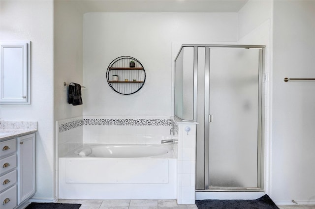31451 Kingsway Rd, Georgetown, TX 78628 - bathroom with vanity, a stall shower, a bath, and tile patterned floors