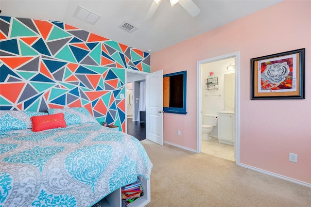 bedroom with carpet flooring, ensuite bath, ceiling fan, and lofted ceiling