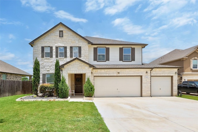 31451 Kingsway Rd, Georgetown, TX 78628 - view of front facade featuring concrete driveway, stone siding, a shingled roof, and a garage