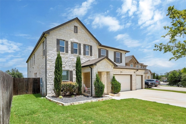 view of front of home featuring a garage and a front yard